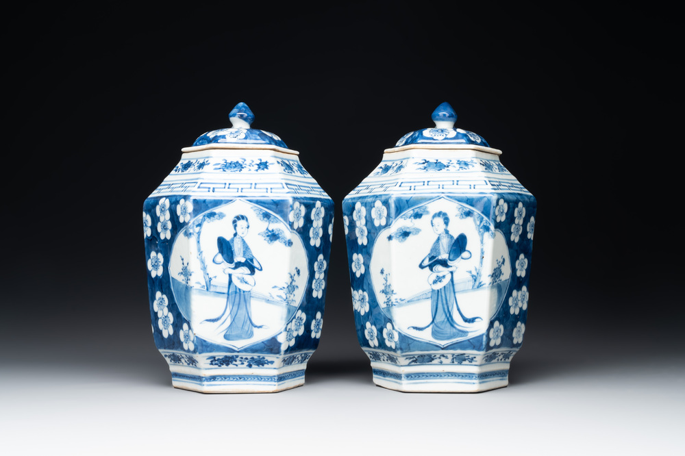 A pair of Chinese blue and white hexagonal jars and covers with a lady holding a fan, 19th C.