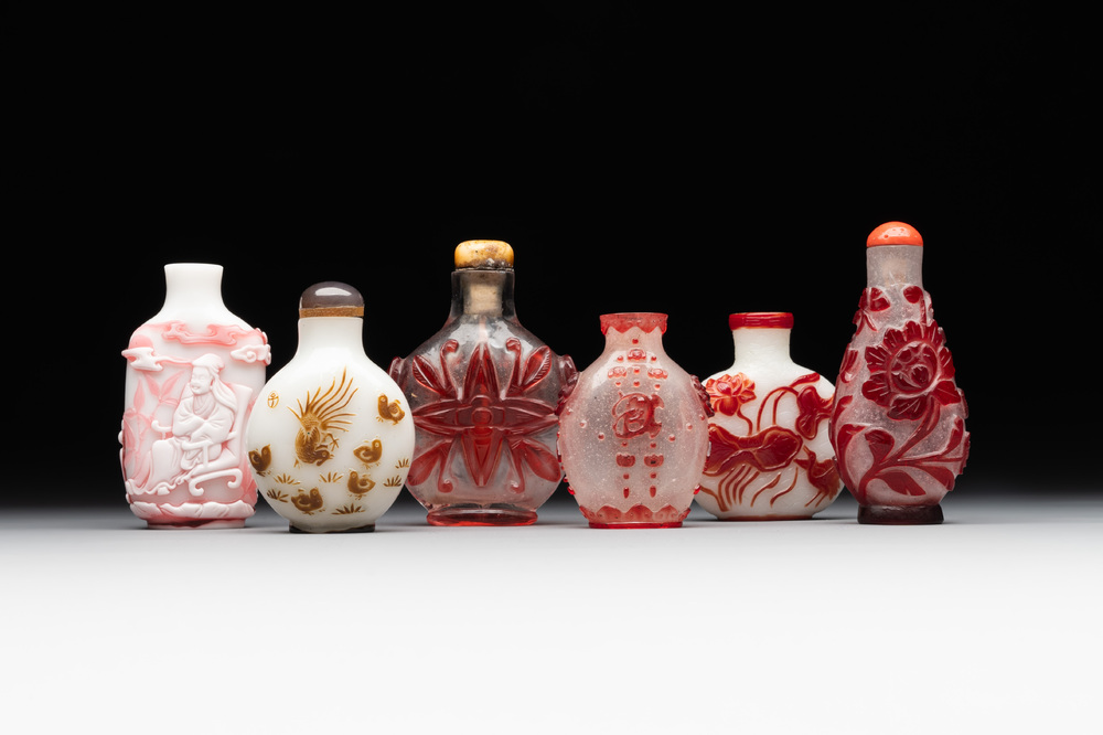 A group of six Chinese overlay glass snuff bottles, 19th C.