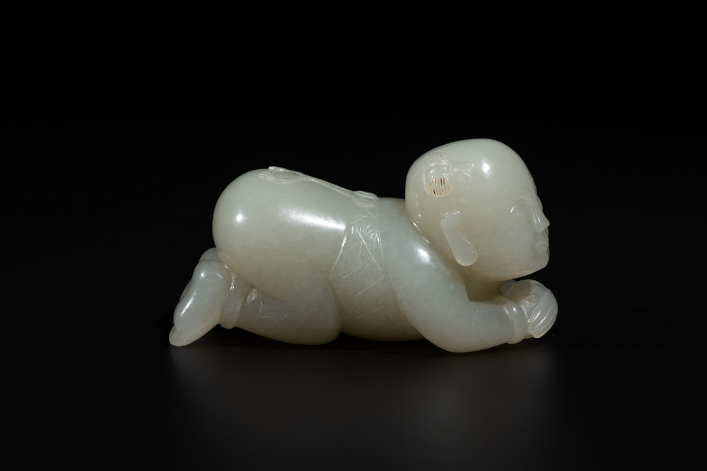 A Chinese white jade carving of a reclining boy, Qing