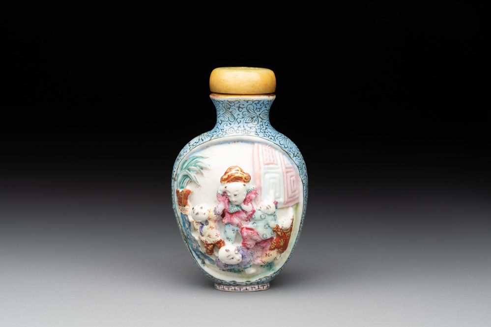 A Chinese moulded famille rose 'playing boys' snuff bottle, Qianlong mark, 19th C.