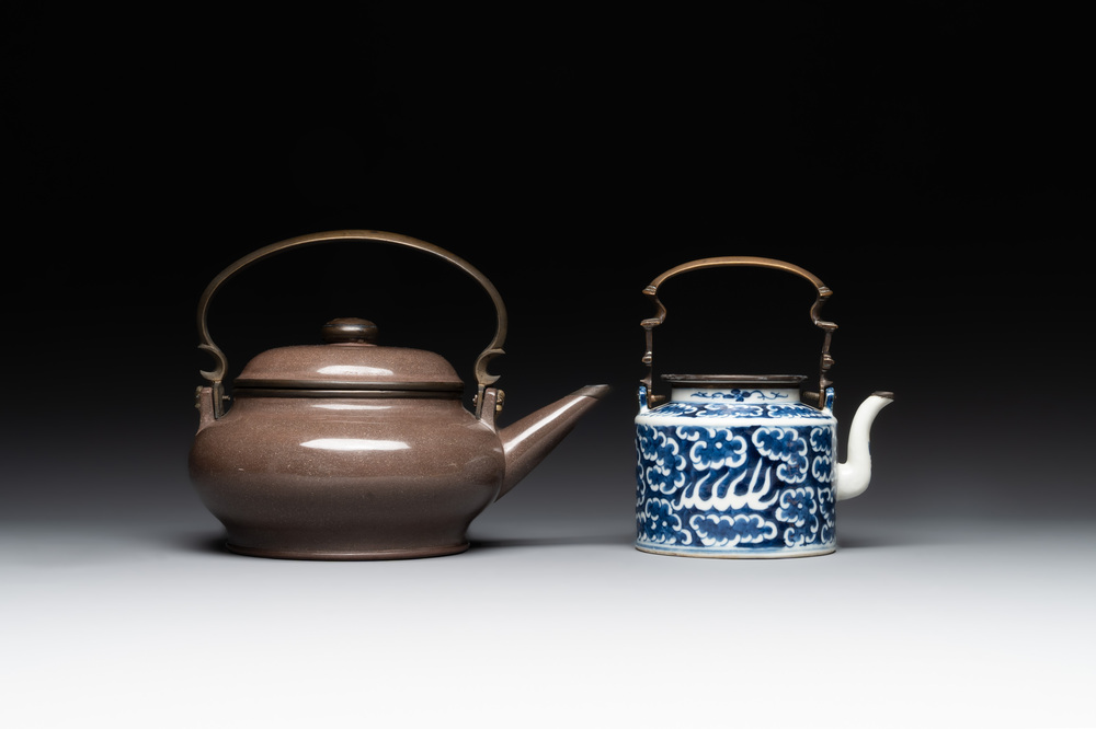 A Chinese polished purple Yixing stoneware covered teapot for the Thai market and a blue and white covered teapot, 19th C.