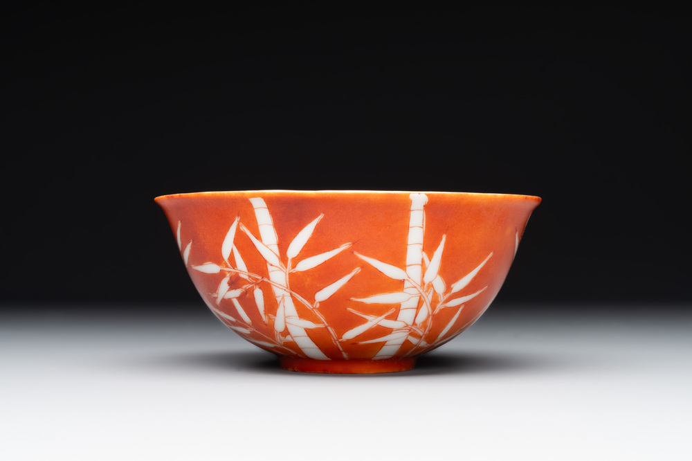A Chinese coral-red-glazed bowl with reverse-decorated bamboo design, Xuantong mark and of the period