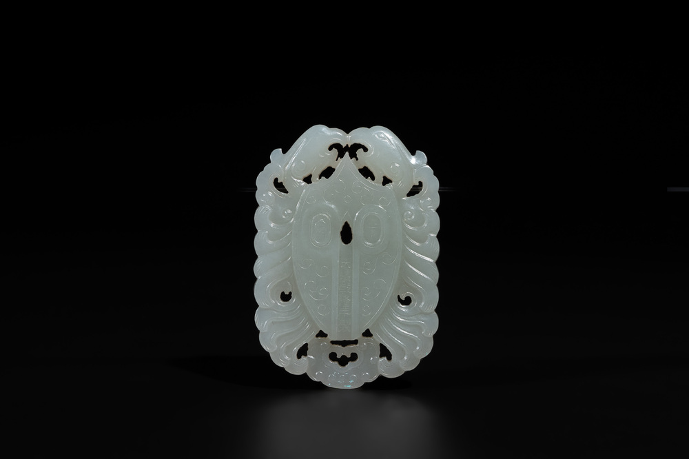 A Chinese white jade 'double phoenix' plaque, Qianlong mark and possibly of the period