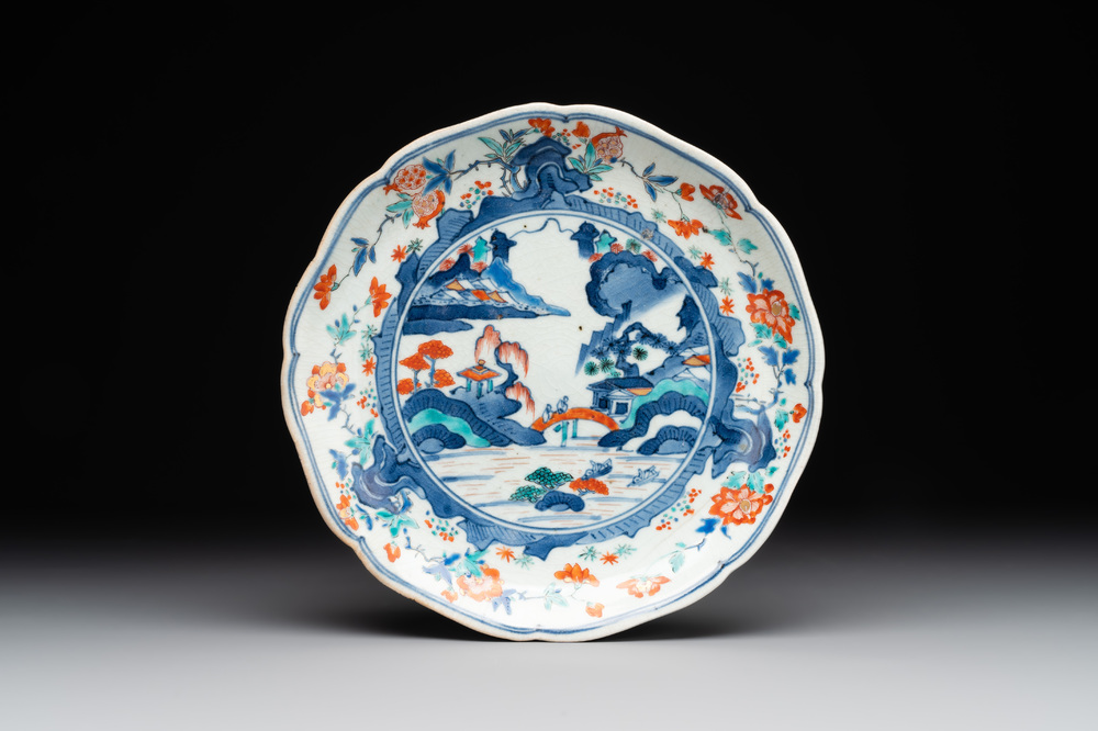 A Japanese Hizen ware Kakiemon-style 'riverside landscape' plate, Edo, 17/18th C.