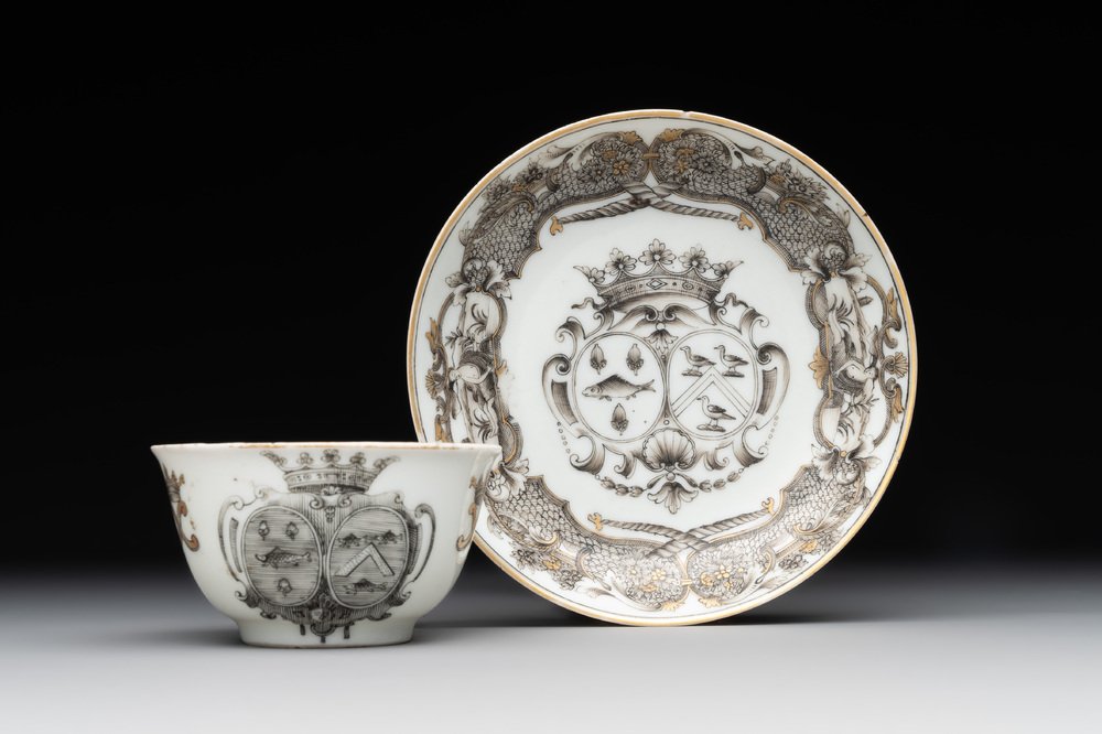 A Chinese gilt-decorated grisaille armorial cup and saucer, Qianlong
