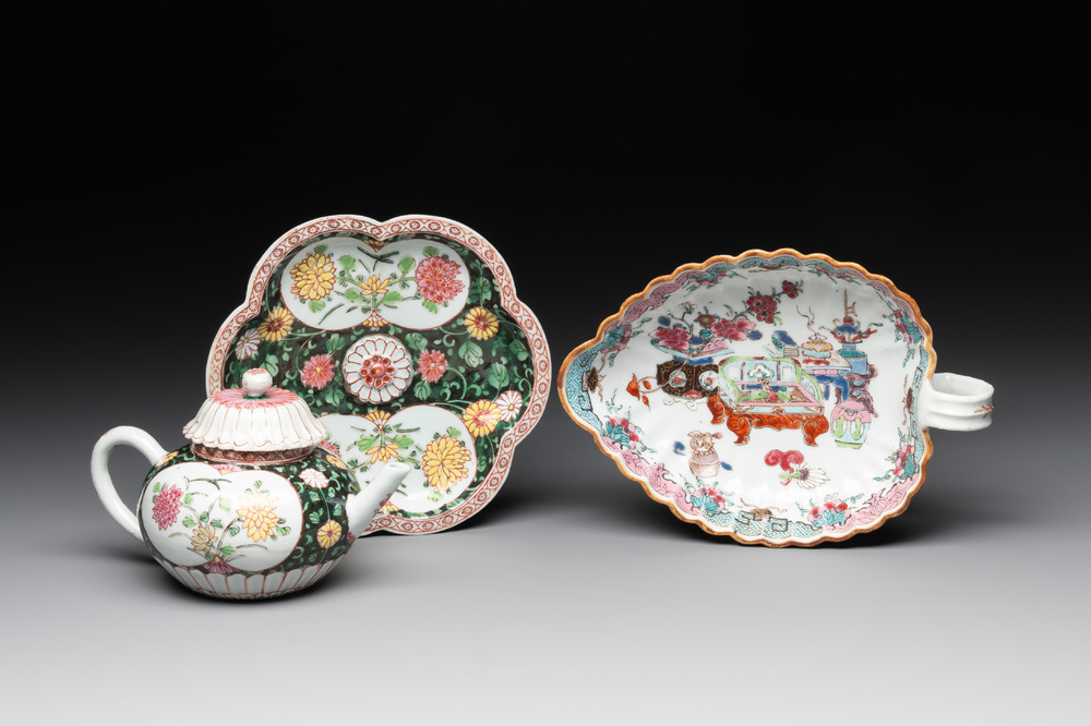A Chinese famille rose black-ground teapot with cover and stand and a sauce boat, Qianlong
