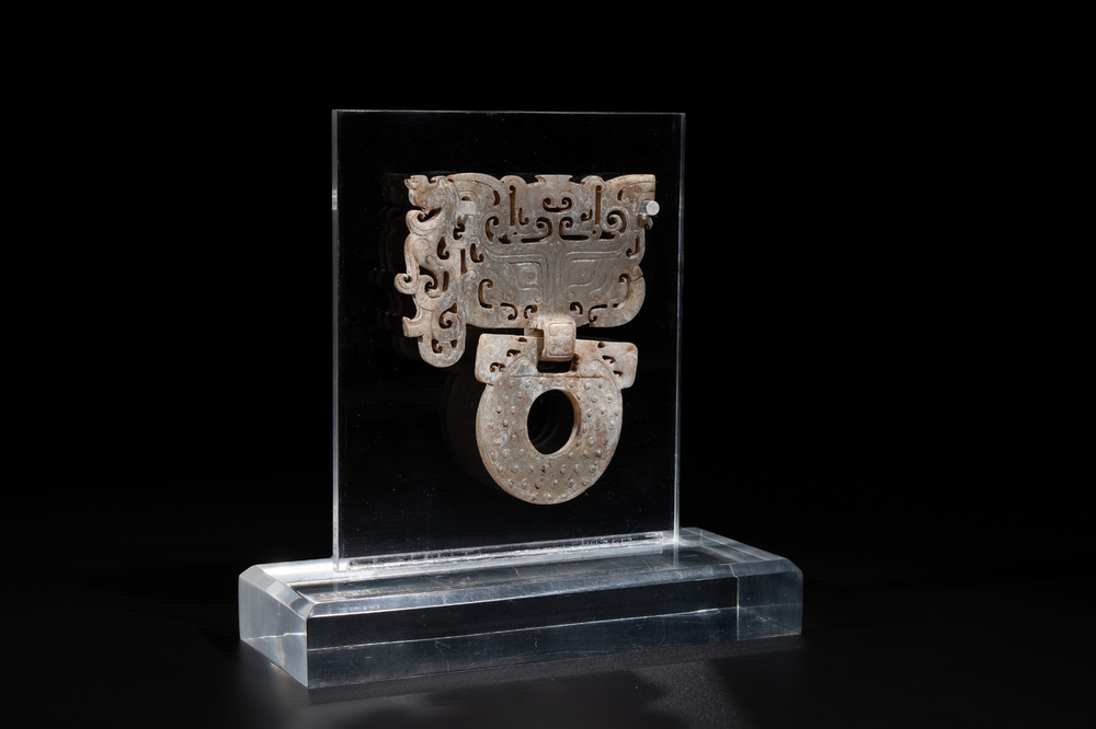 A Chinese nephrite jade 'bi' disc representing a Taotie mask, Han