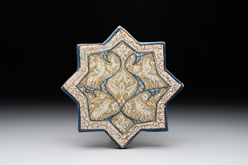 An intact Kashan lustre-glazed star tile, Persia, 13/14th C.