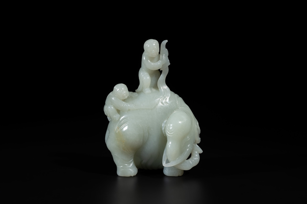 A Chinese celadon jade group of two boys cleansing an elephant, 18th C.