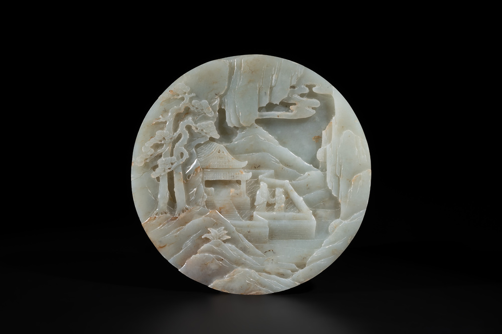 A Chinese celadon and russet jade plaque with landscape design, 19th C.