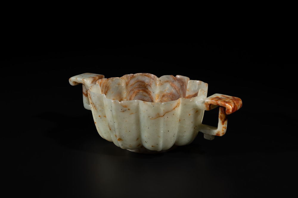 A Chinese celadon and russet jade wedding cup, 18th C.