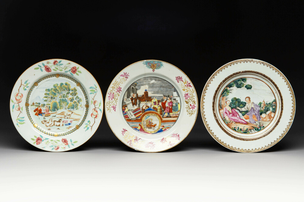 Three Chinese export famille rose 'Cloth Traders', 'Shepherds' and a scene from a fable by La Fontaine plates, Qianlong