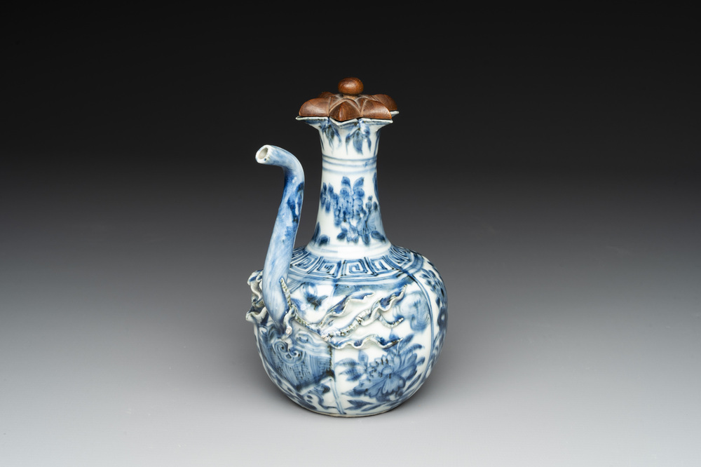 A fine Chinese blue and white 'pomegranate' kendi and a wooden cover, Wanli