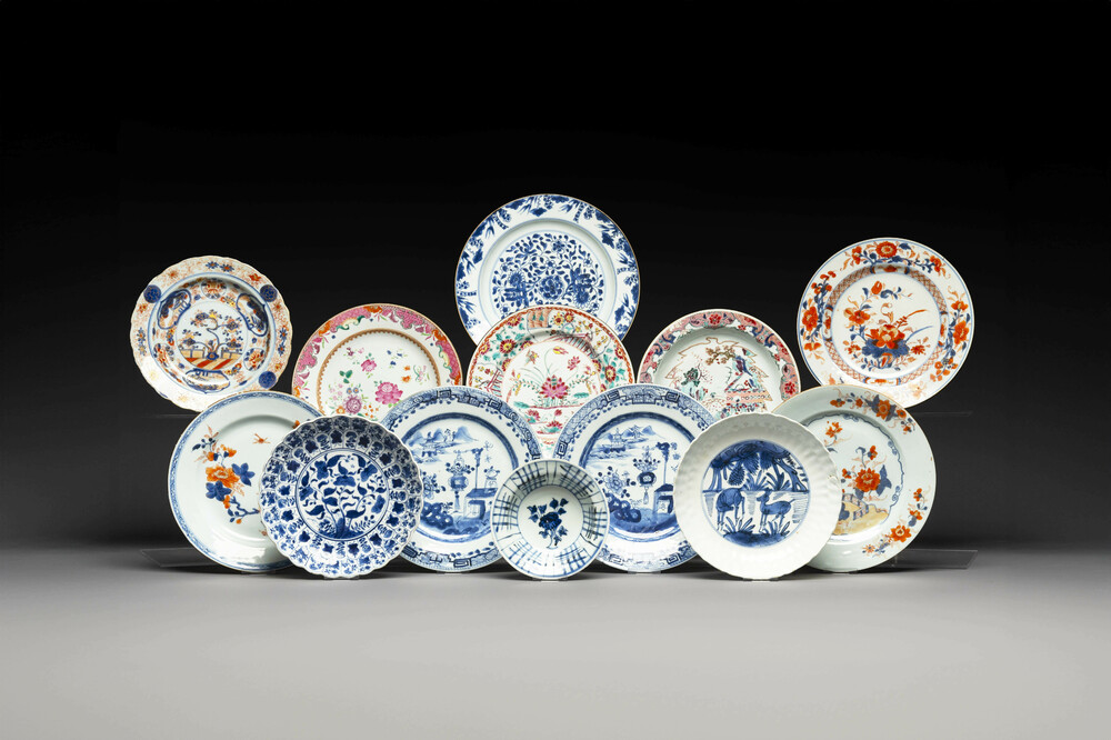 A group of thirteen Chinese blue, white and famille rose plates and a bowl, late Ming/early Qing