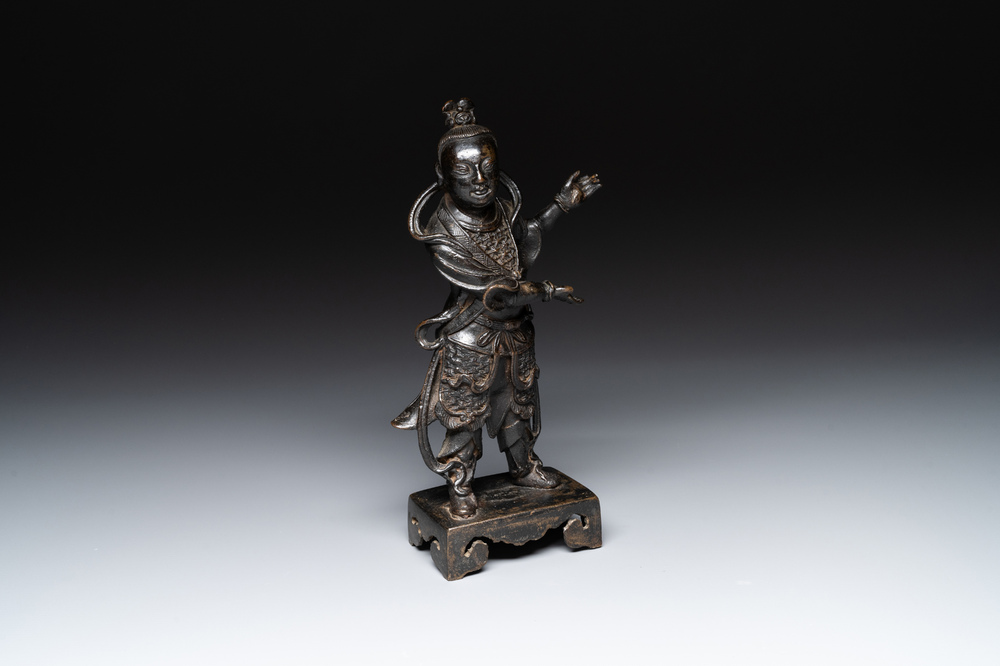 A fine Chinese bronze figure of a divinity, Ming