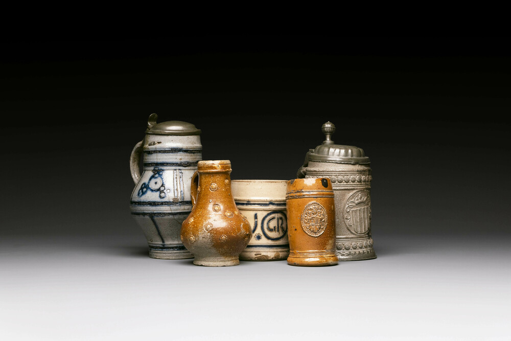 Five stoneware mugs and jugs with various seals, Germany, 16/17th C.