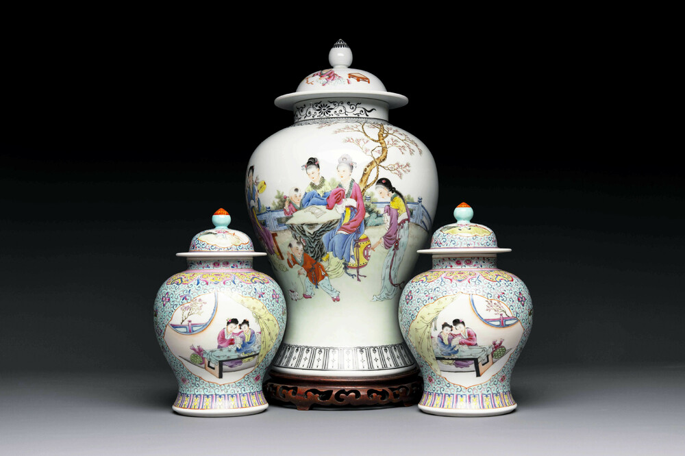 A Chinese famille rose covered vase and a pair of small covered vases, Qianlong mark, 20th C.