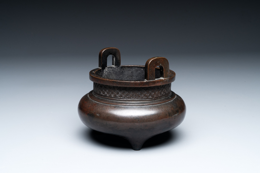 A Chinese bronze two-handled tripod censer, Ding 鼎 mark, Yuan/Ming
