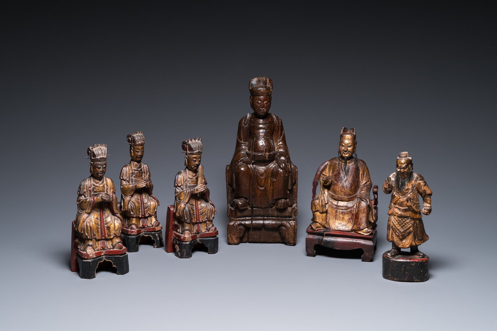 Six Chinese gilt-lacquered wooden sculptures of dignitaries and a guard, Ming and later
