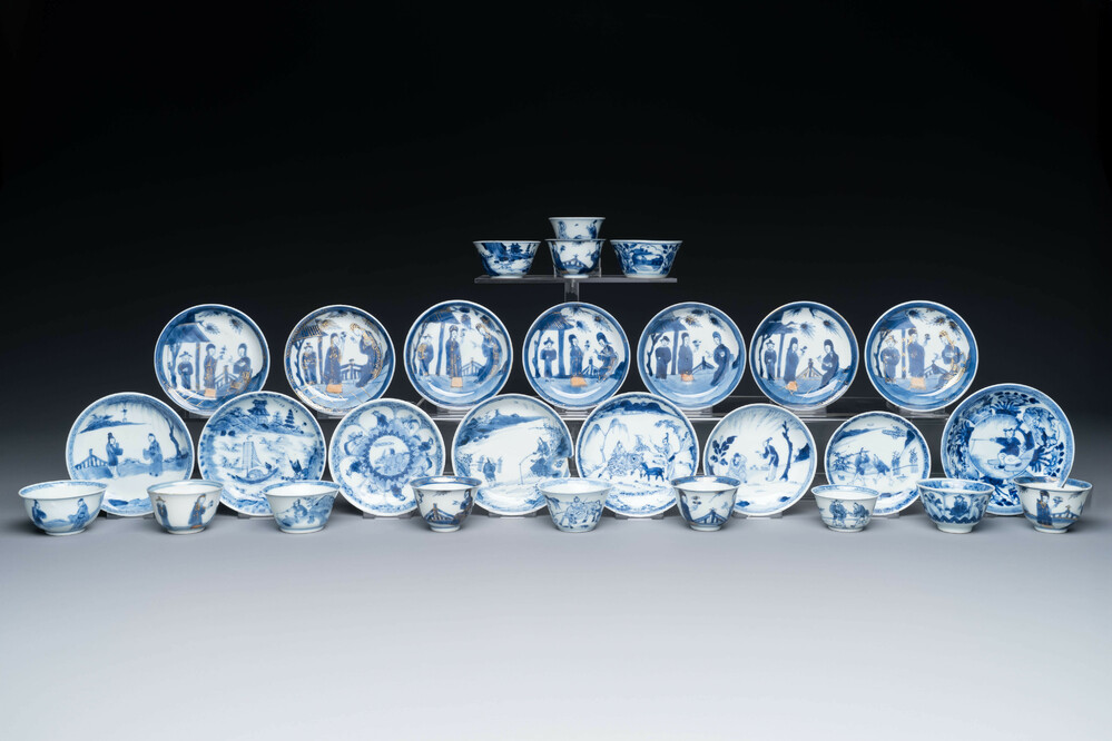 15 Chinese blue and white saucers and 13 cups with figural design, Kangxi/Yongzheng