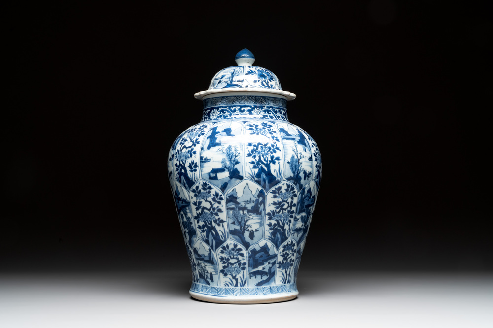 A Chinese blue and white vase and cover with landscapes and flowers, Kangxi