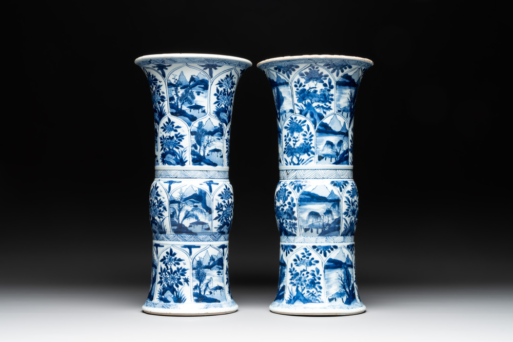 Two Chinese blue and white 'gu' vases with landscape and floral panels, Kangxi