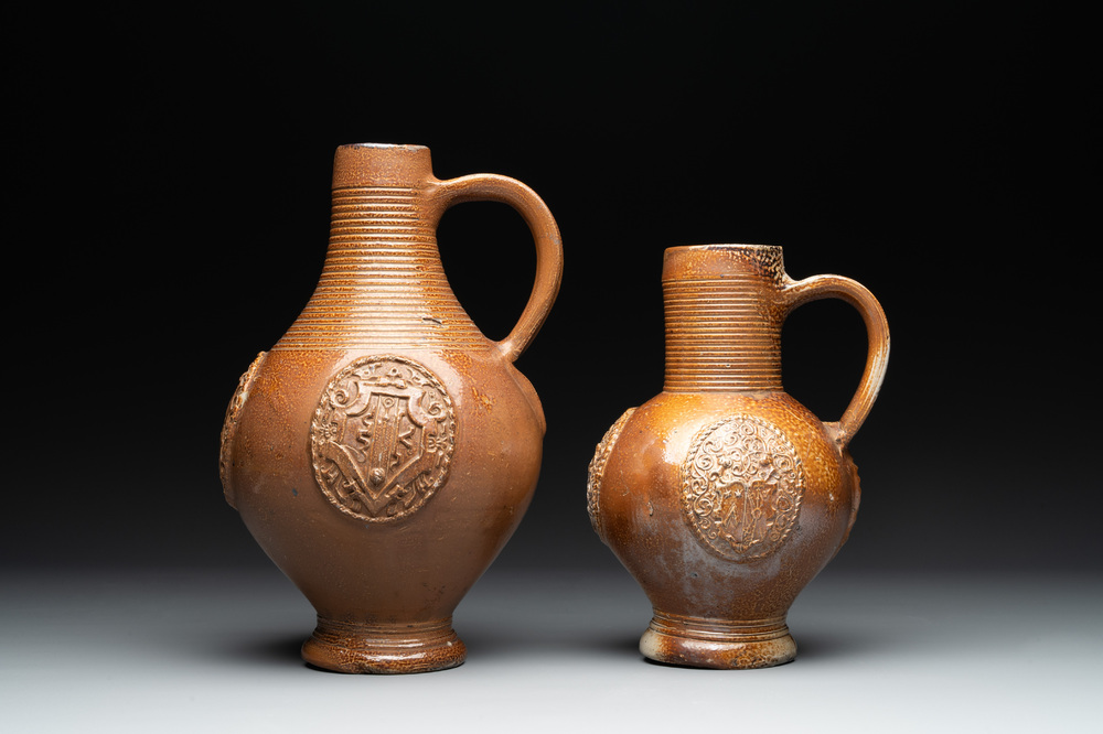 Two armorial stoneware jugs, Raeren, one dated 1586, 16/17th C.