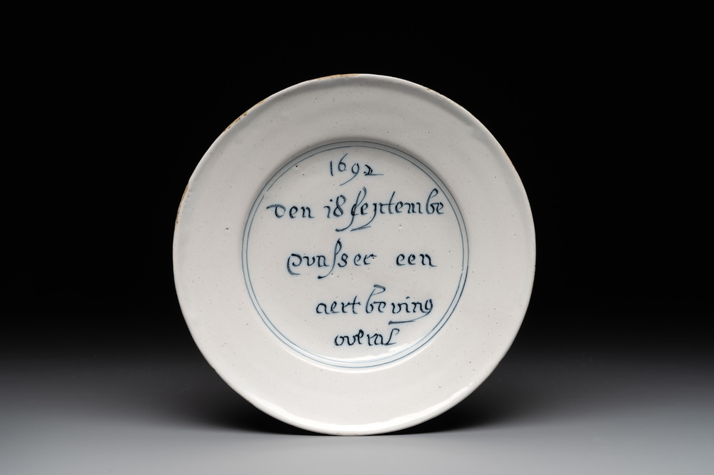 A rare Dutch Delft blue and white 'earthquake' plate, dated 1692