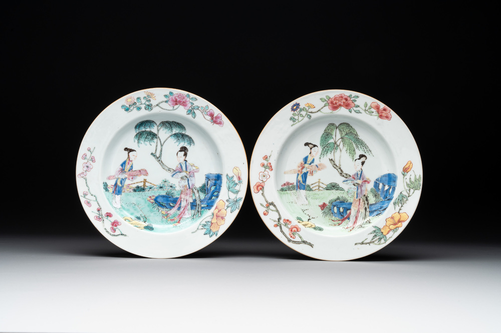 A pair of Chinese famille rose 'ladies in a garden' plates, Yongzheng