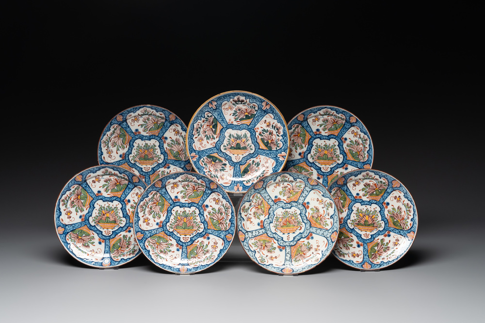 Seven Dutch Delft polychrome 'flower basket' plates, 18th C.