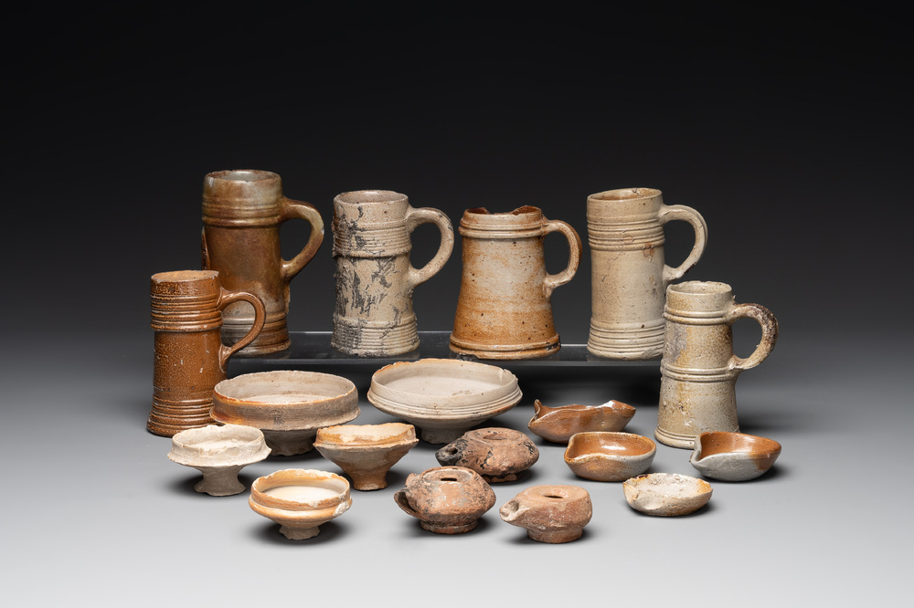 A 18-piece study collection of stoneware mugs, drinking vessels, pottery and stoneware oil lamps, mainly Germany, 15th C. and later