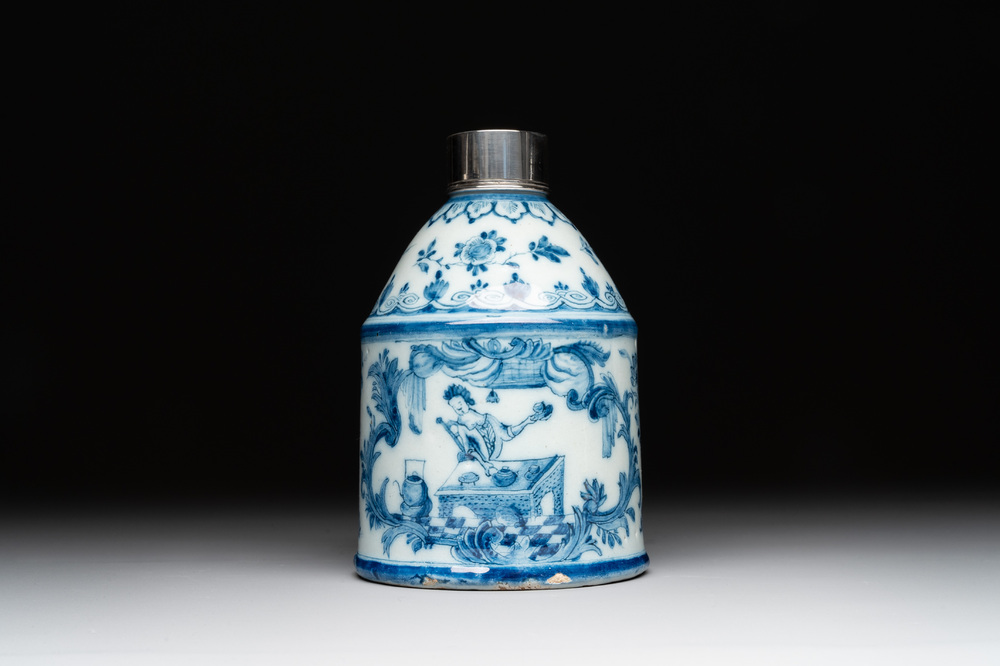A Dutch Delft blue and white tea caddy with a pipe smoker, 18th C.