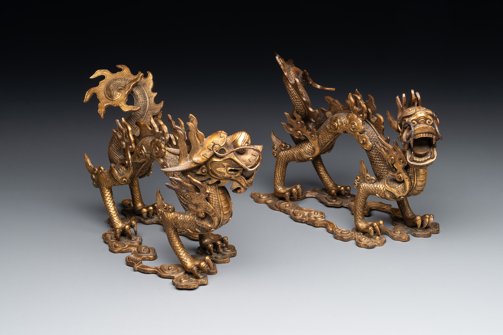 A pair of Chinese gilt bronze dragons among flames and clouds, 19/20th C.
