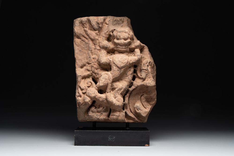 An Indian architectural red sandstone fragment with a divinity, 13th C.