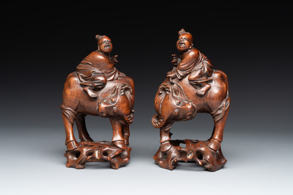 A pair of Chinese carved bamboo groups of a boy riding a buffalo, 19/20th C.