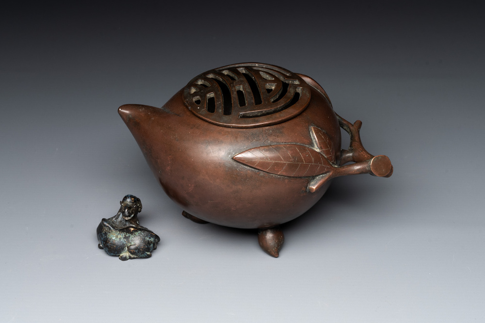 A Chinese bronze camel-form paperweight and a peach-shaped covered censer, 19th C.