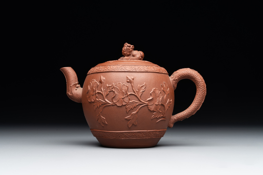 A Chinese Yixing stoneware teapot with relief design, Kangxi