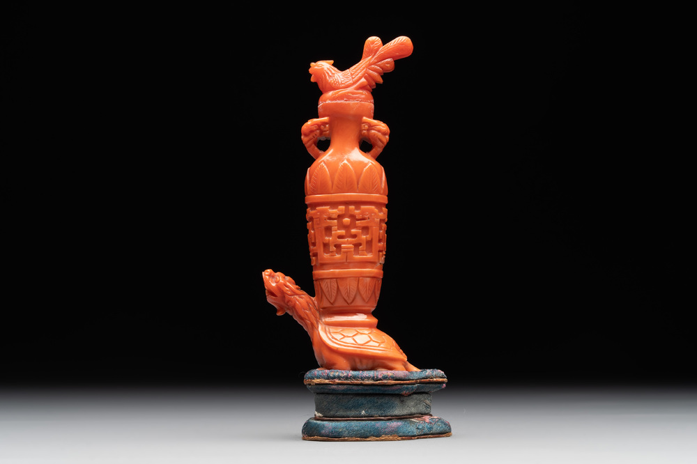 A Chinese carved red coral 'mythical animals' snuff bottle on stand, 19/20th C.