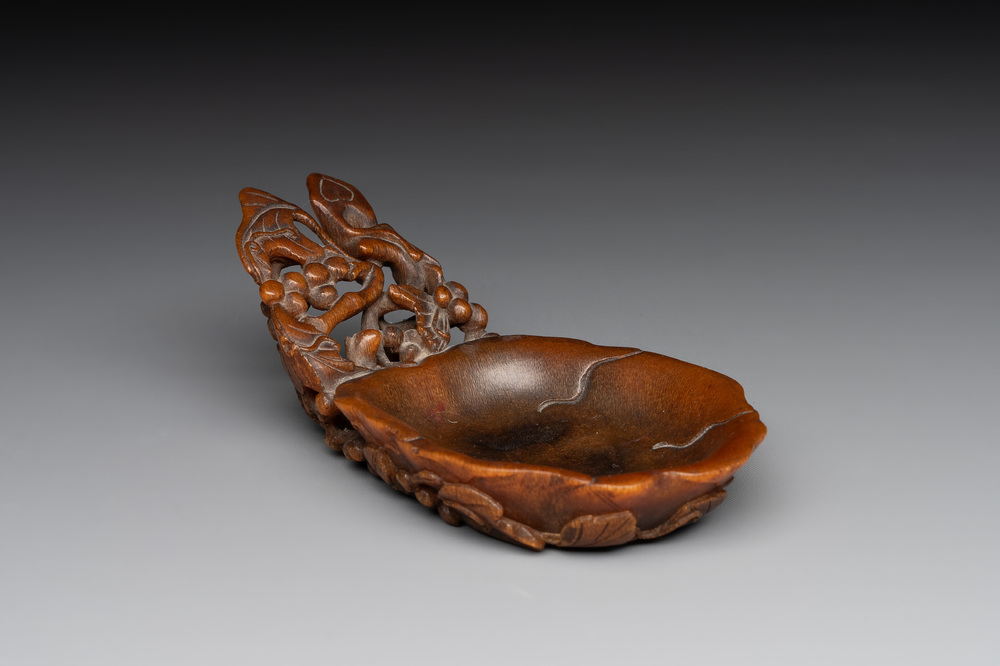 A rare Chinese carved rhinoceros horn 'libation cup' with grape design, 17/18th C.