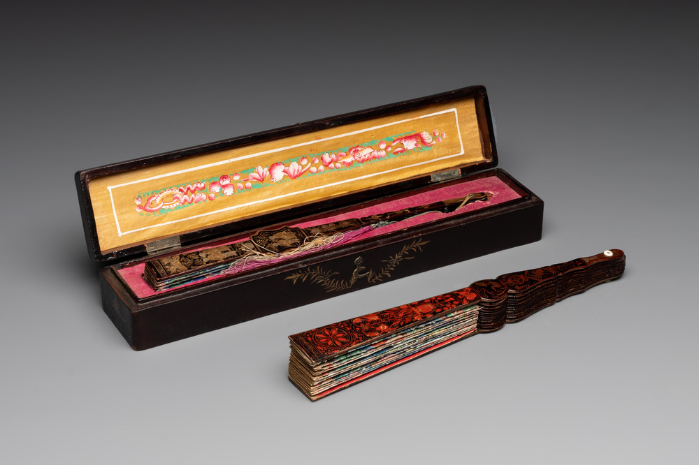Two Chinese Canton gilt-lacquered and painted paper fans, one with original box, 19th C.