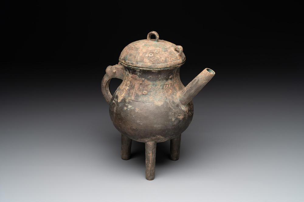 A Chinese inscribed archaic bronze tripod ritual wine vessel and cover, 'He 盉', Western Zhou