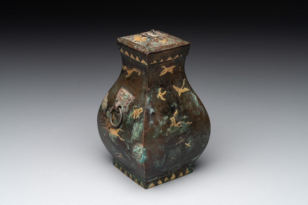 A rare Chinese archaic partially gilt bronze ritual wine vessel and cover, 'fang hu 方壺', Han