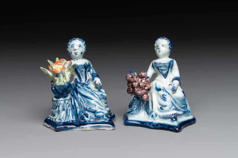 A pair of polychrome Dutch Delft groups of merchant ladies, 18th C.