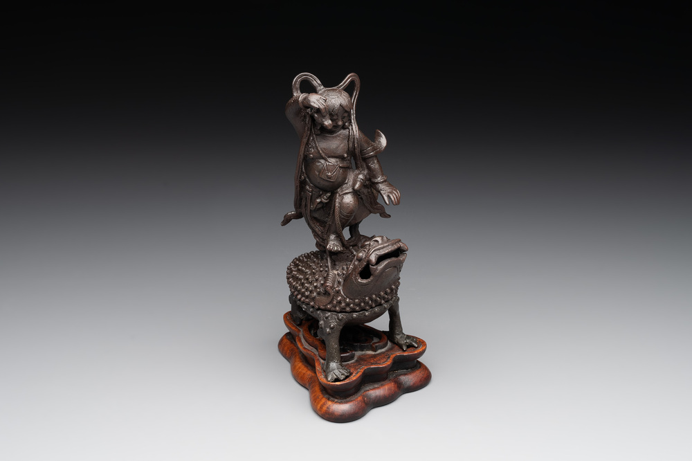 A rare Chinese bronze incense burner and cover in the shape of Liu Hai and a three legged toad, Ming