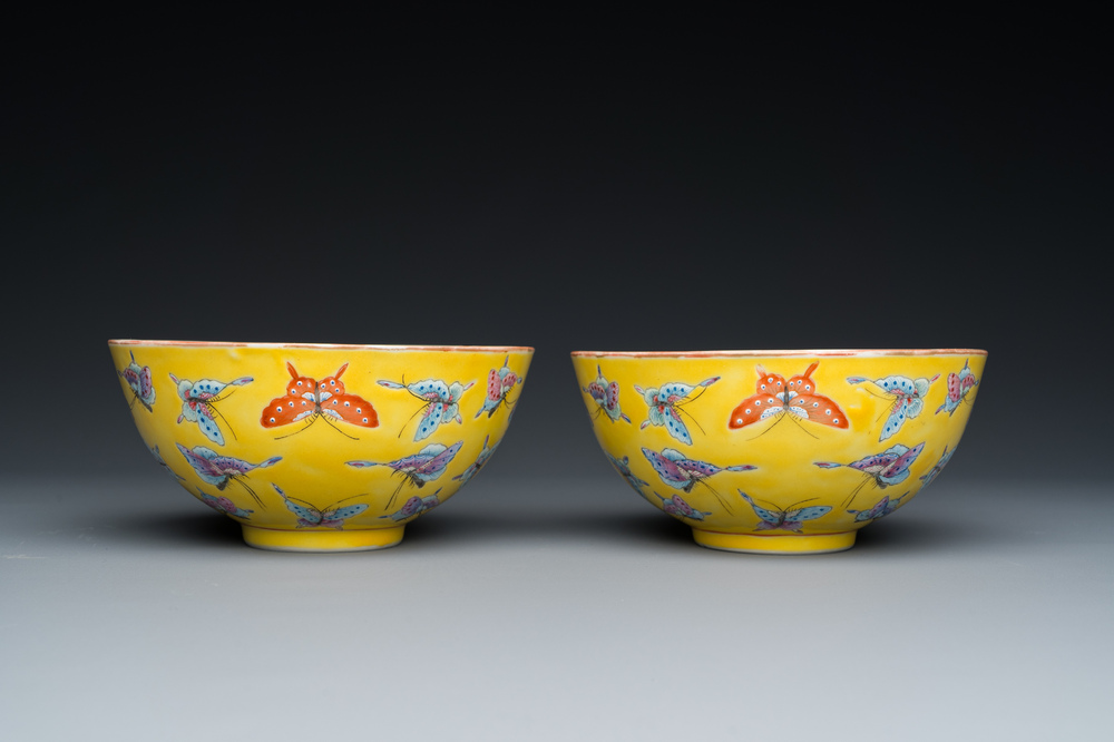 A pair of Chinese famille rose yellow-ground 'butterfly' bowls, Tongzhi mark, 20th C.