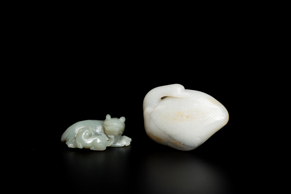 A Chinese celadon jade carving of a lion with cub and a white jade carving of a goose, Qing