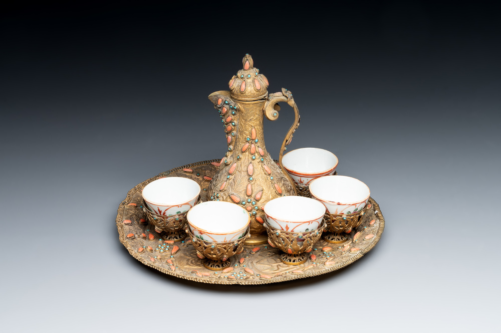 An Ottoman coral-and-turquoise-inlaid gilt-copper tea service with five Chinese wucai cups, 19th C.
