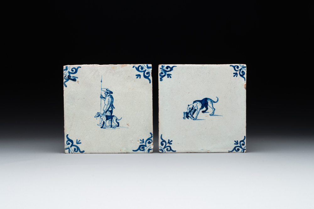 Two blue and white Dutch Delft 'shepherd and dog' and 'dog with puppy' tiles, 17th C.