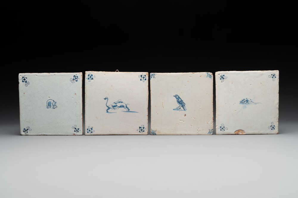 Four blue and white Dutch Delft elephant, boars, bird and mouse tiles, 17th C.
