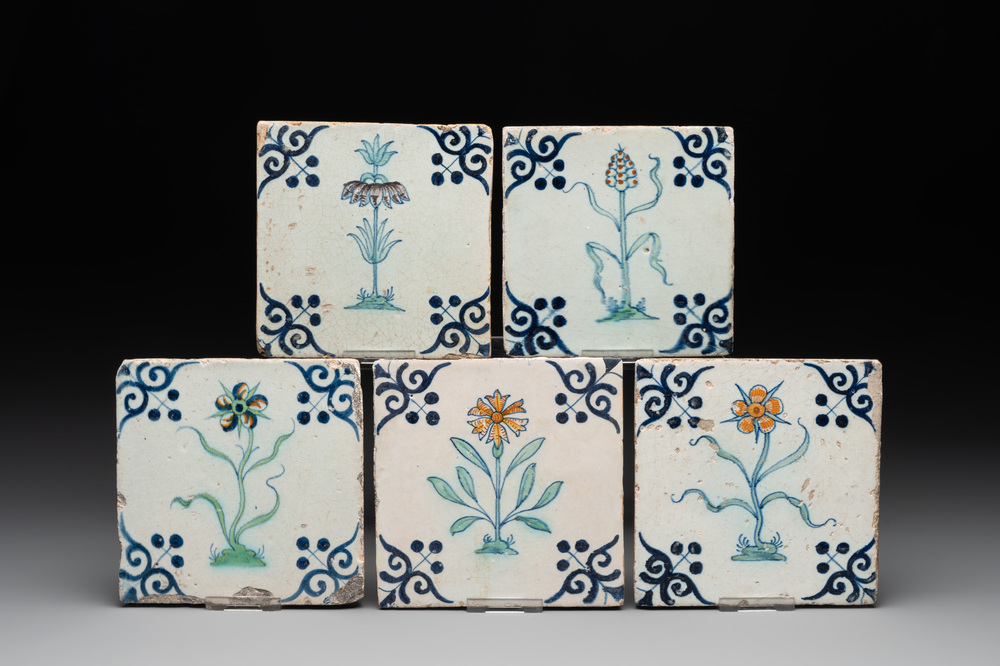 Five polychrome Dutch Delft 'flower' tiles, 17th C.
